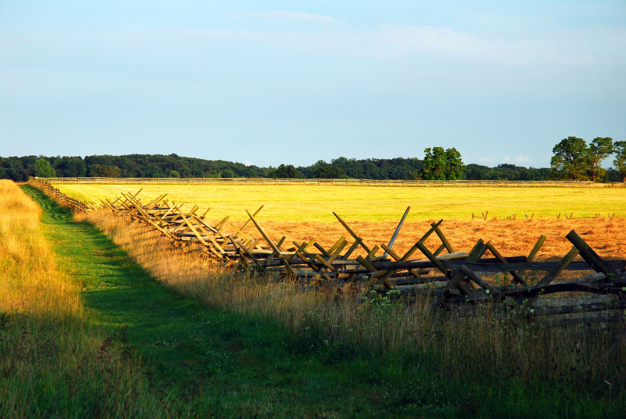 A split rail fence marks a path for hikers to visit the sacred ground of Gettysburg National Battlefield in Pennsylvania. The site involved one of the bloodiest battles of the American Civil War