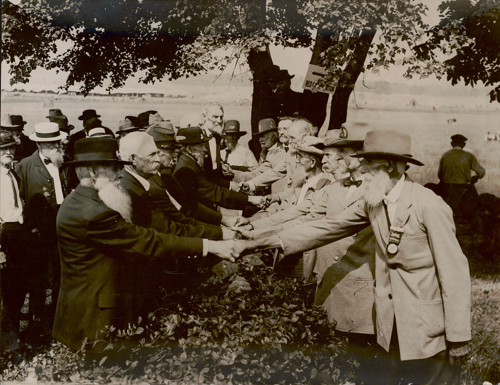 Union and Confederate veterans shake hands at the “Bloody Angle” in 1913