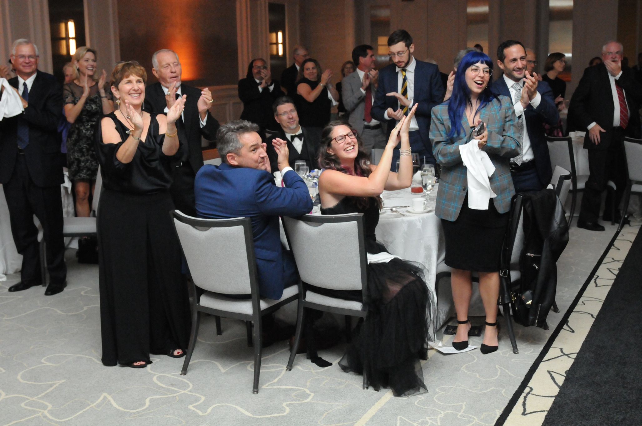 Audience standing and clapping at the Teach for Freedom gala