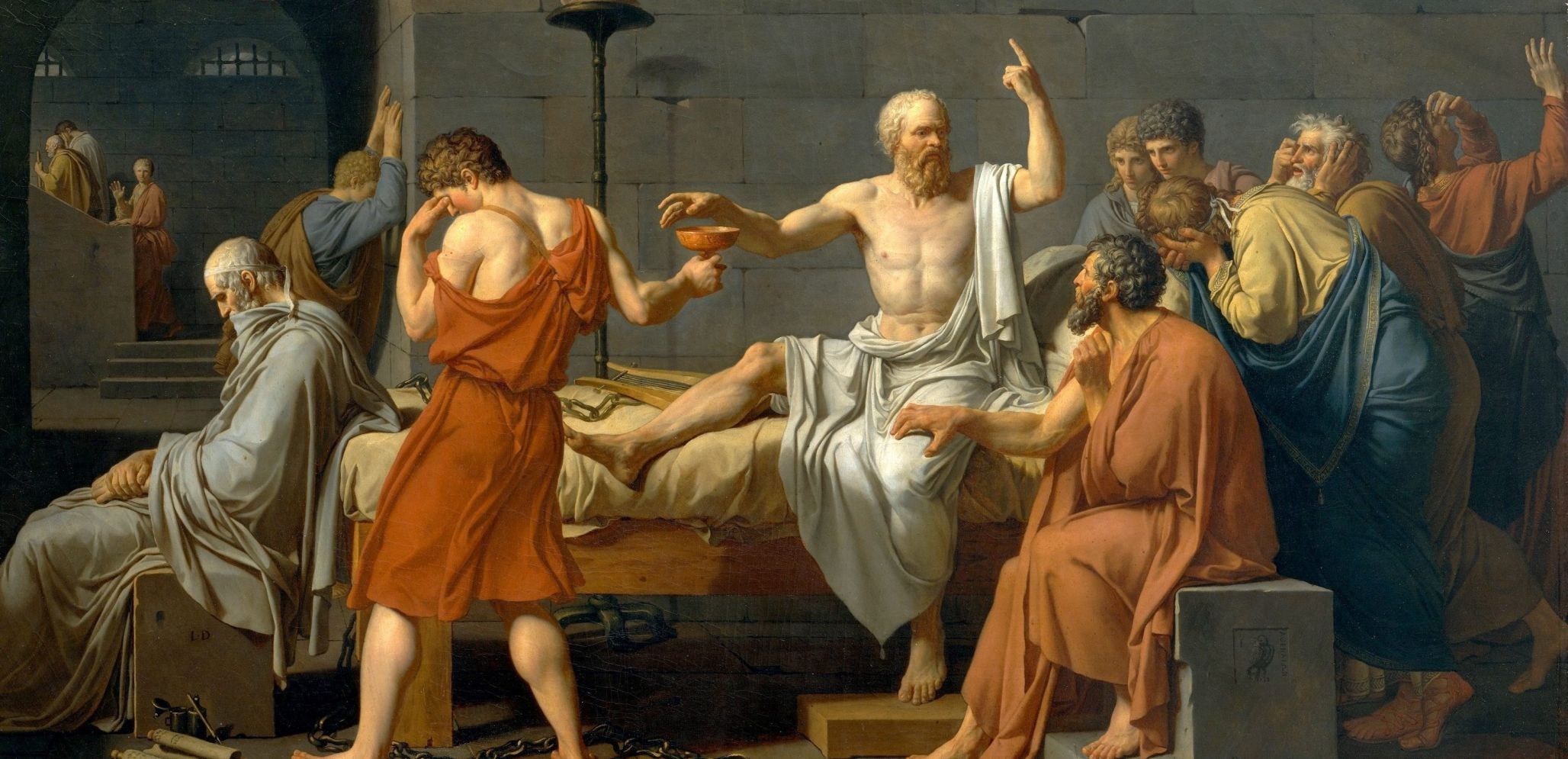 The Death of Socrates. Painting of a group of ancient figures focused on a central, bearded man seated on a bed, pointing upward. The man in orange holds a cup, and others react emotionally. The scene is set indoors with stone walls, evoking a dramatic, historical moment.