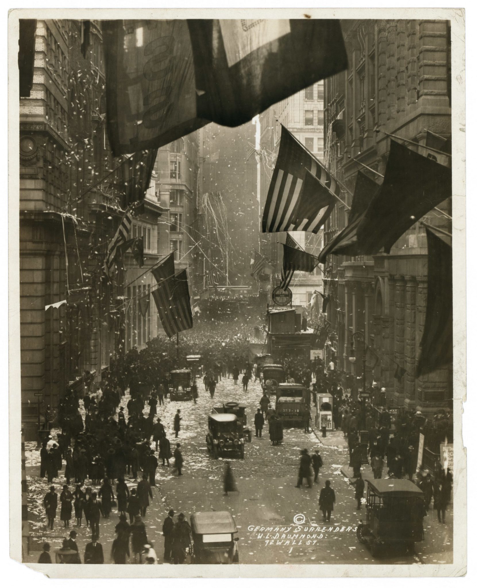 Wall Street, New York waving American flags after Germany surrenders