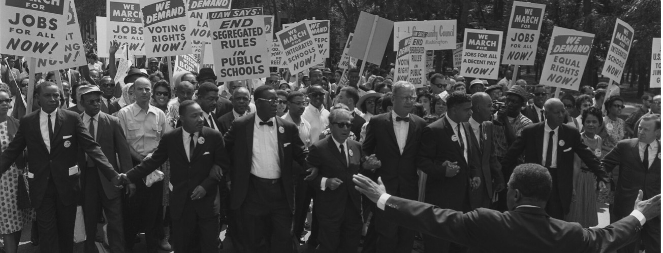 Matin Luther King Jr. walking with Civil Rights activists