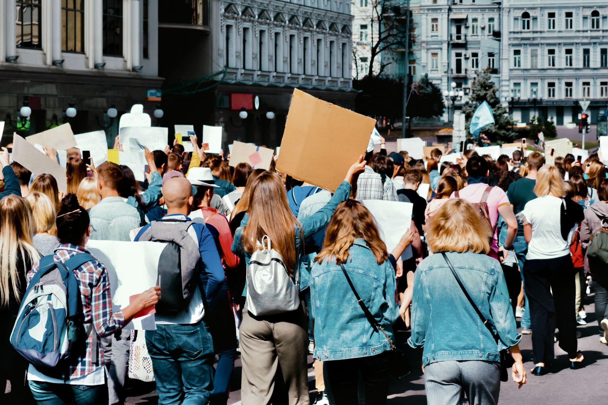 Young people marching on the street protest.